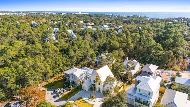 birds eye view of property featuring a residential view and a view of trees