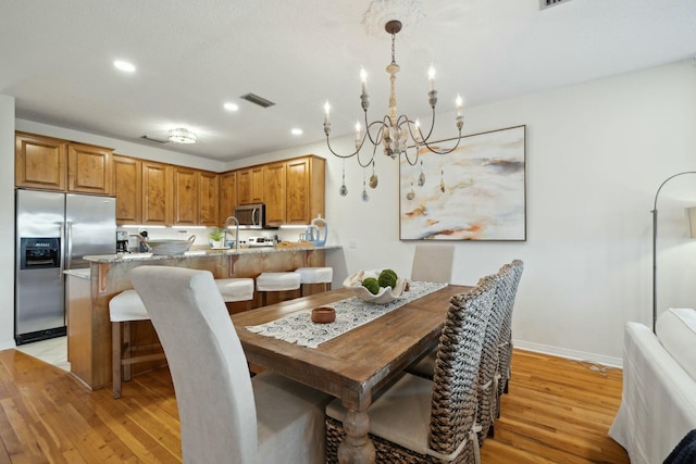 10 Mar A Lago Blvd # 14, Santa Rosa Beach, FL 32459 - dining space with light wood-style floors, visible vents, recessed lighting, and a chandelier