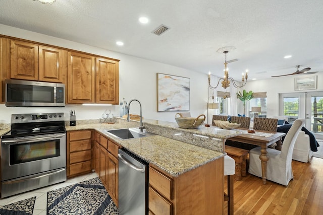 10 Mar A Lago Blvd # 14, Santa Rosa Beach, FL 32459 - kitchen featuring a sink, a kitchen breakfast bar, stainless steel appliances, a peninsula, and visible vents