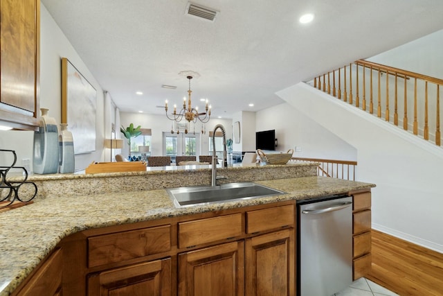 10 Mar A Lago Blvd # 14, Santa Rosa Beach, FL 32459 - kitchen with brown cabinets, a sink, dishwasher, a chandelier, and visible vents