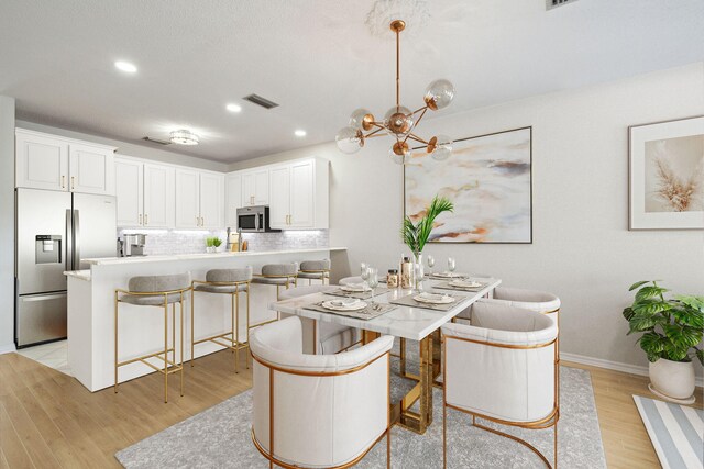 10 Mar A Lago Blvd # 14, Santa Rosa Beach, FL 32459 - dining area with an inviting chandelier, light wood-style floors, recessed lighting, baseboards, and visible vents