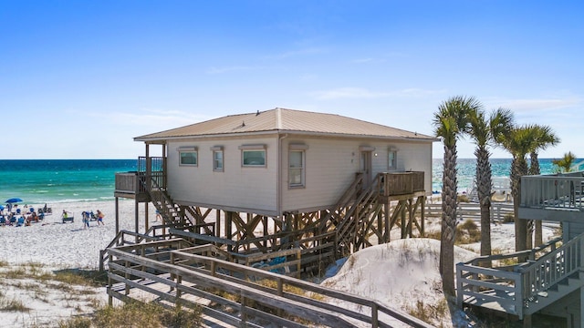 17 Fort Panic Rd, Santa Rosa Beach, FL 32459 - exterior space with stairs, a water view, a beach view, and metal roof