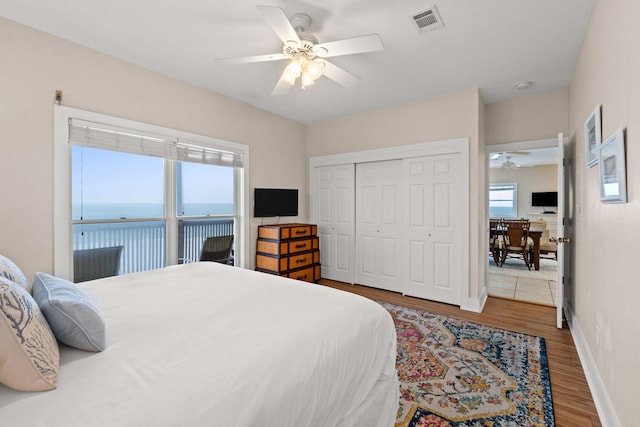 17 Fort Panic Rd, Santa Rosa Beach, FL 32459 - bedroom with a closet, wood finished floors, baseboards, visible vents, and ceiling fan