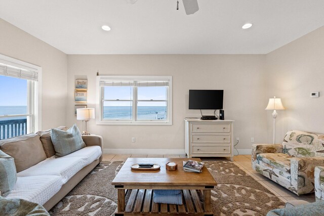 17 Fort Panic Rd, Santa Rosa Beach, FL 32459 - living area with light tile patterned floors, baseboards, ceiling fan, and a wealth of natural light