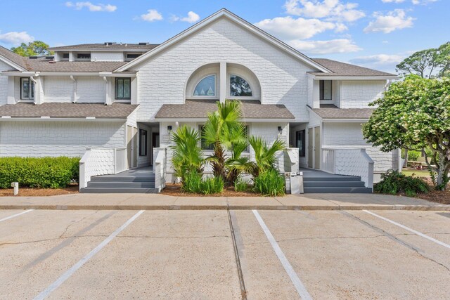 8980 Heron Walk Dr # 8980, Miramar Beach, FL 32550 - view of front facade with uncovered parking and roof with shingles
