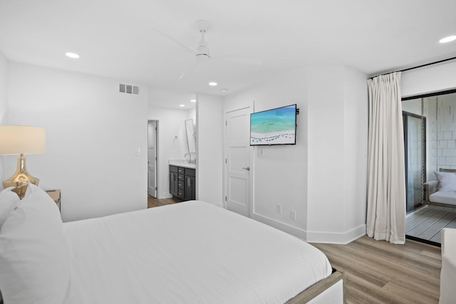 8980 Heron Walk Dr # 8980, Miramar Beach, FL 32550 - bedroom with wood finished floors, visible vents, recessed lighting, and ensuite bathroom