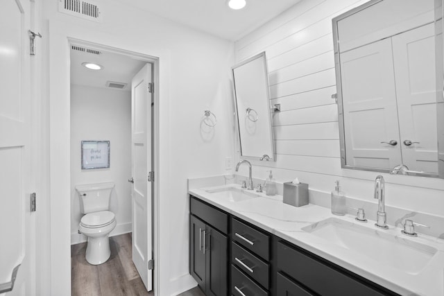 8980 Heron Walk Dr # 8980, Miramar Beach, FL 32550 - full bath featuring wood finished floors, visible vents, toilet, and a sink