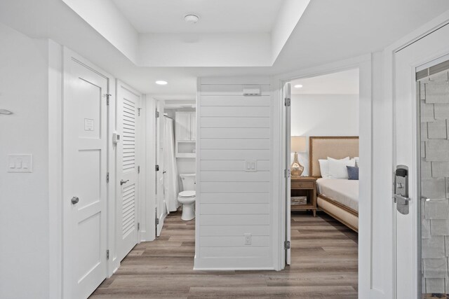 8980 Heron Walk Dr # 8980, Miramar Beach, FL 32550 - ensuite bathroom featuring a stall shower, toilet, recessed lighting, wood finished floors, and connected bathroom
