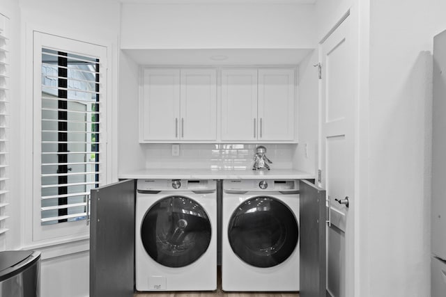8980 Heron Walk Dr # 8980, Miramar Beach, FL 32550 - washroom featuring cabinet space and independent washer and dryer
