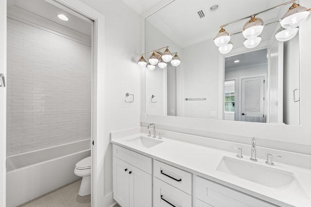 full bath featuring double vanity, visible vents, a sink, and toilet