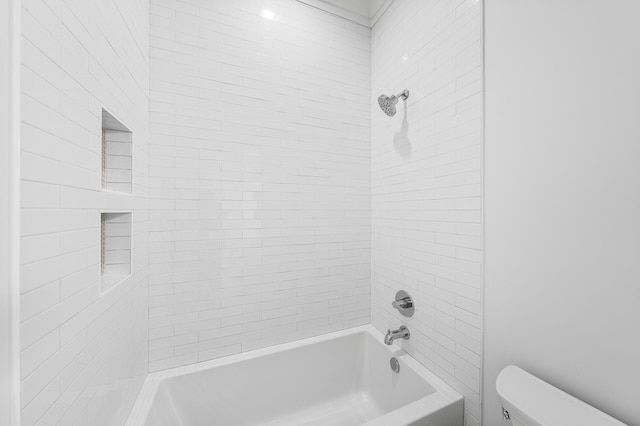 bathroom featuring toilet and tub / shower combination