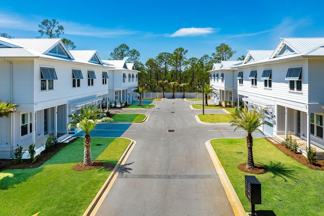 view of street with curbs and a residential view