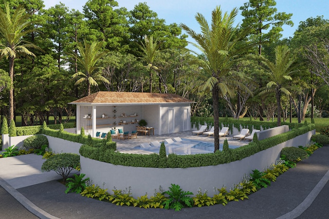 view of pool featuring a fenced in pool, a patio, and an outdoor structure