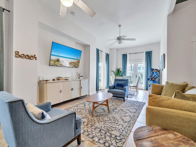 living room with a ceiling fan and light tile patterned flooring