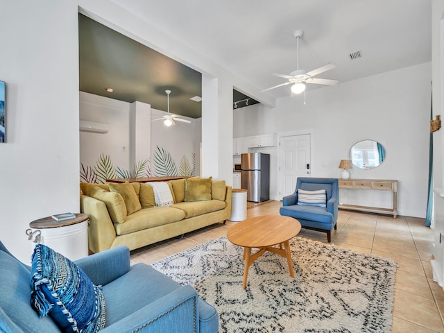 living area featuring visible vents, a ceiling fan, an AC wall unit, and light tile patterned floors