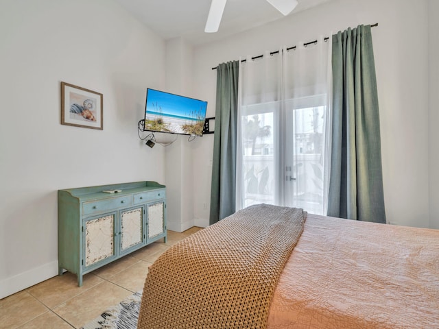 bedroom with baseboards, ceiling fan, and light tile patterned flooring