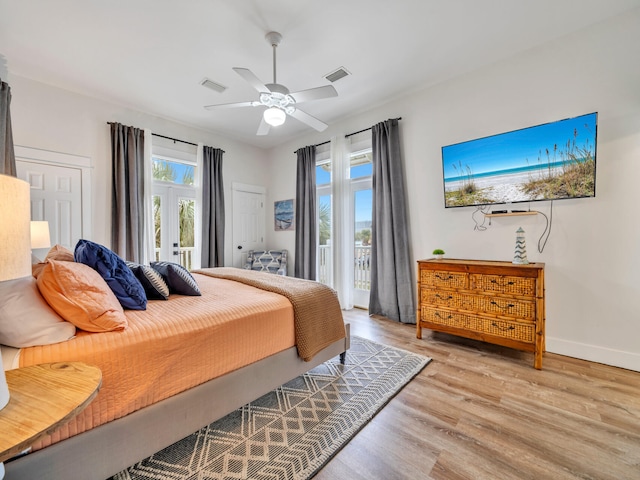 bedroom with visible vents, a ceiling fan, baseboards, light wood-style flooring, and access to outside