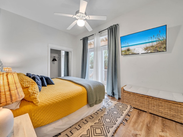 bedroom with wood finished floors and a ceiling fan