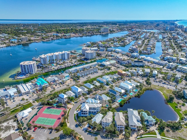 drone / aerial view featuring a city view and a water view