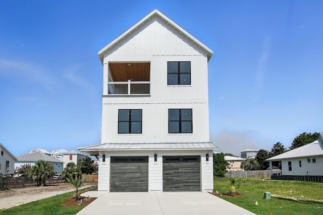 162 Casting Lake Rd, Miramar Beach, FL 32550 - view of front facade featuring an attached garage, concrete driveway, a balcony, and a metal roof