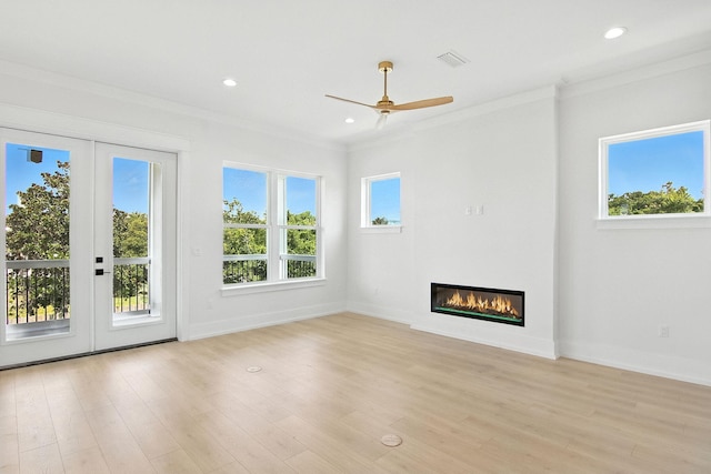 162 Casting Lake Rd, Miramar Beach, FL 32550 - unfurnished living room featuring ornamental molding, a glass covered fireplace, ceiling fan, light wood finished floors, and recessed lighting