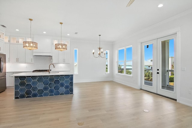 162 Casting Lake Rd, Miramar Beach, FL 32550 - kitchen featuring a chandelier, freestanding refrigerator, light countertops, light wood-type flooring, and recessed lighting