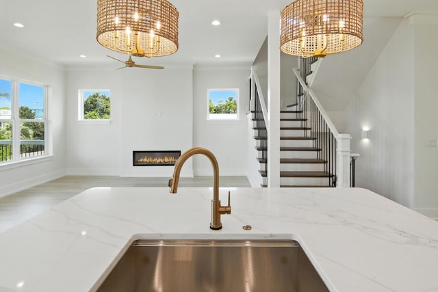 162 Casting Lake Rd, Miramar Beach, FL 32550 - kitchen with a chandelier, open floor plan, plenty of natural light, crown molding, and recessed lighting