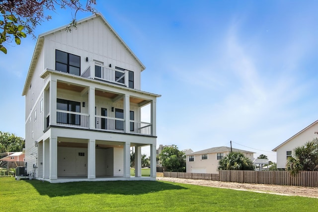 162 Casting Lake Rd, Miramar Beach, FL 32550 - rear view of house featuring a balcony, board and batten siding, and a patio
