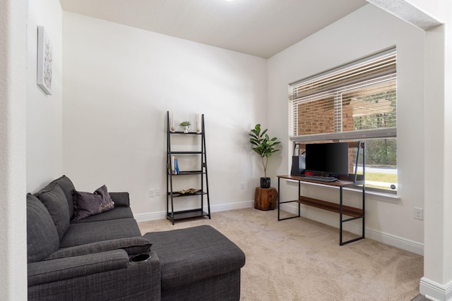 carpeted office space with baseboards