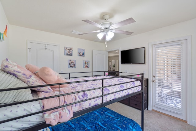 carpeted bedroom with access to exterior and ceiling fan