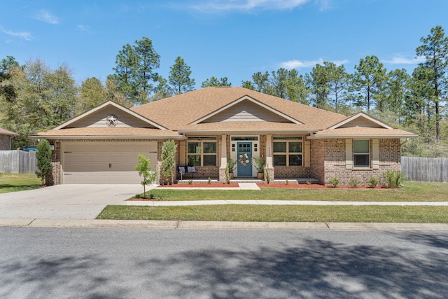 view of front facade featuring brick siding, concrete driveway, fence, and an attached garage