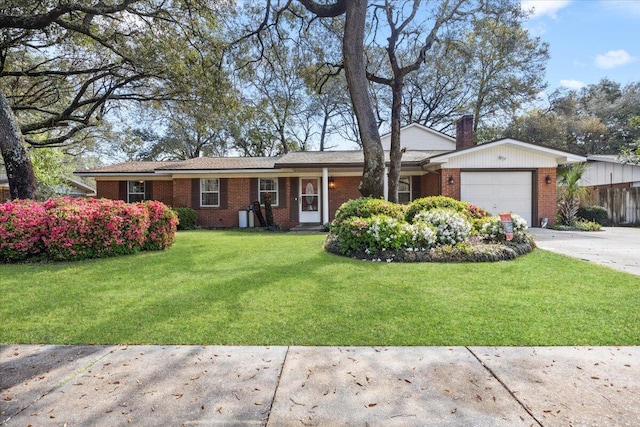 ranch-style house with a chimney, a front yard, a garage, and brick siding