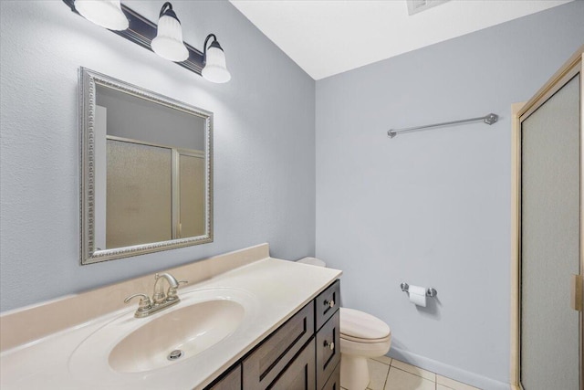 bathroom with vanity, toilet, tile patterned floors, and a shower stall