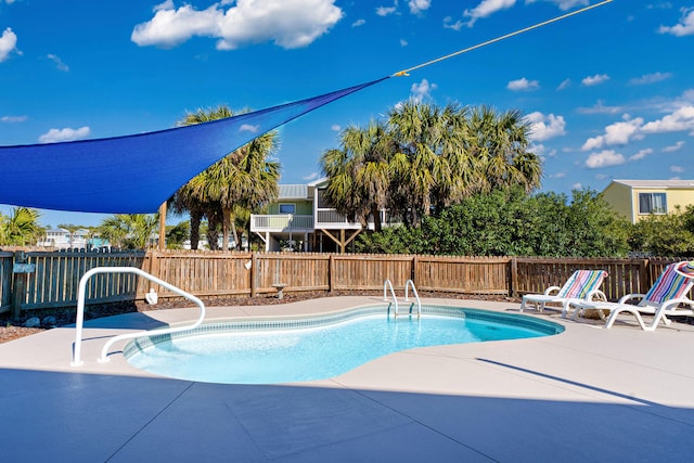 617 E E Gorrie Dr, Saint George Island, FL 32328 - view of swimming pool with a patio, a fenced in pool, and a fenced backyard