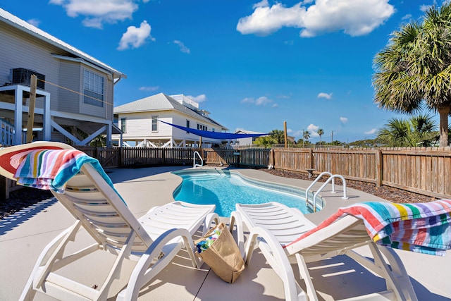 617 E E Gorrie Dr, Saint George Island, FL 32328 - view of swimming pool featuring a fenced backyard, a patio area, and a fenced in pool