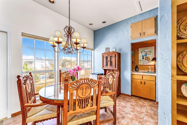 617 E E Gorrie Dr, Saint George Island, FL 32328 - dining space featuring light tile patterned flooring, baseboards, and an inviting chandelier