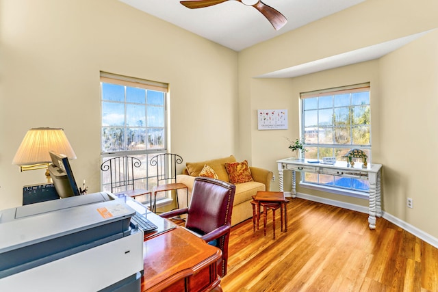 617 E E Gorrie Dr, Saint George Island, FL 32328 - office area featuring a ceiling fan, baseboards, a healthy amount of sunlight, and light wood finished floors