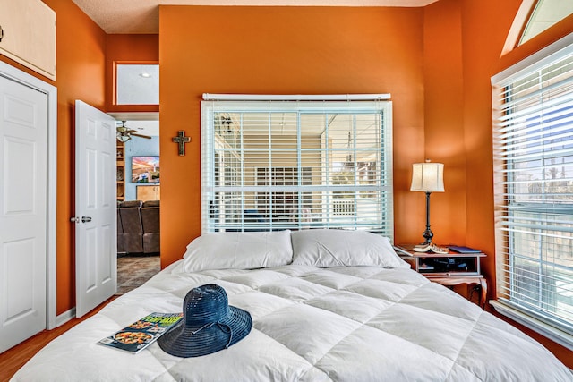 617 E E Gorrie Dr, Saint George Island, FL 32328 - bedroom featuring multiple windows and wood finished floors