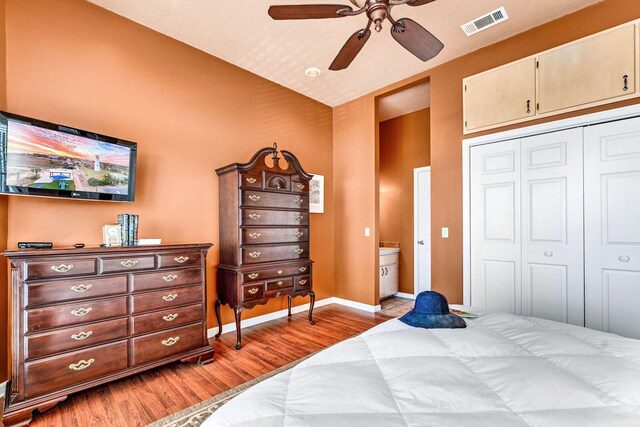 617 E E Gorrie Dr, Saint George Island, FL 32328 - bedroom featuring light wood-type flooring, baseboards, visible vents, a ceiling fan, and a closet