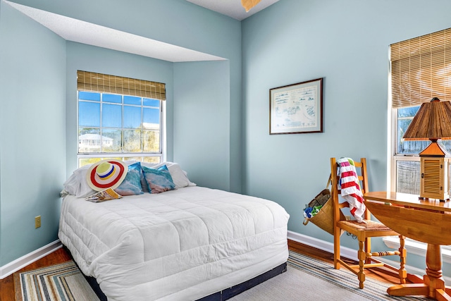 617 E E Gorrie Dr, Saint George Island, FL 32328 - bedroom featuring baseboards and wood finished floors