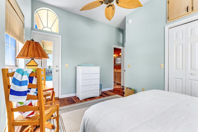 617 E E Gorrie Dr, Saint George Island, FL 32328 - bedroom featuring a closet, baseboards, vaulted ceiling, and wood finished floors