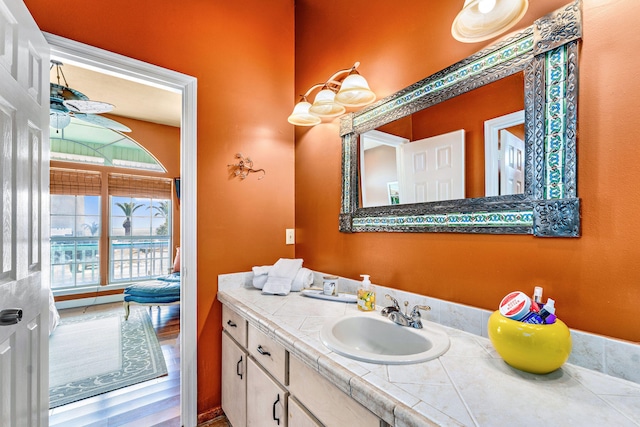 617 E E Gorrie Dr, Saint George Island, FL 32328 - bathroom featuring ceiling fan and vanity