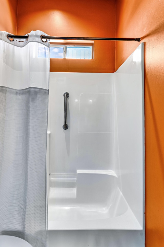 617 E E Gorrie Dr, Saint George Island, FL 32328 - full bathroom featuring curtained shower
