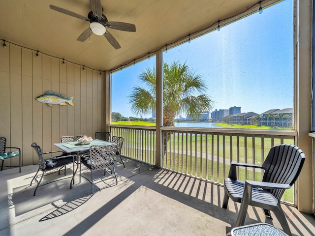 825 Seascape Dr Unit 407, Miramar Beach, FL 32550 - view of patio / terrace with a water view, ceiling fan, and outdoor dining space