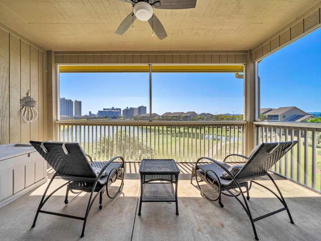 825 Seascape Dr Unit 407, Miramar Beach, FL 32550 - sunroom with a water view, a wealth of natural light, and a ceiling fan