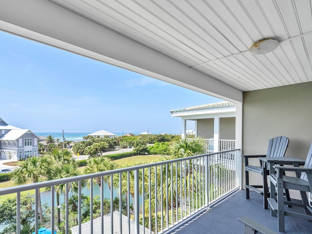 balcony featuring a water view