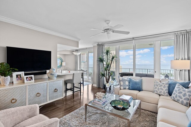 1 Beach Club Dr Unit 1205, Miramar Beach, FL 32550 - living area with crown molding, wood finished floors, plenty of natural light, a water view, and ceiling fan