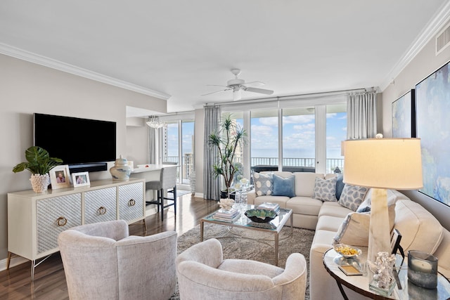 1 Beach Club Dr Unit 1205, Miramar Beach, FL 32550 - living area with crown molding, wood finished floors, ceiling fan, baseboards, and a chandelier