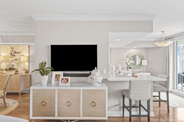 1 Beach Club Dr Unit 1205, Miramar Beach, FL 32550 - living room featuring crown molding, light wood-style flooring, and a chandelier