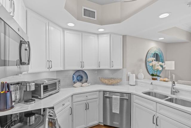 1 Beach Club Dr Unit 1205, Miramar Beach, FL 32550 - kitchen with stainless steel appliances, a sink, recessed lighting, light countertops, and white cabinetry